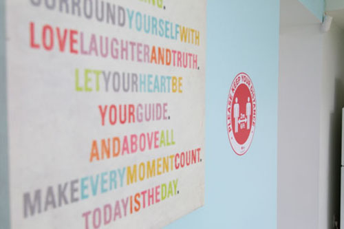 Gym with social distancing signs on wall