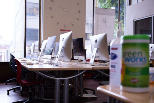 Alexander Academy computer lab with sanitizer on table