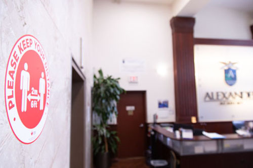 Alexander Academy lobby with social distancing sign