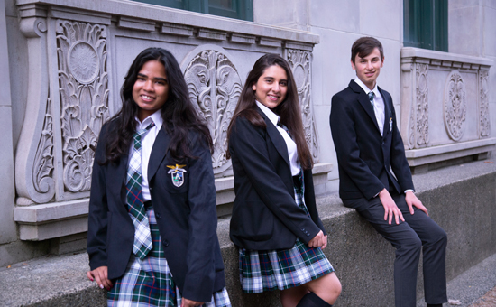 Alexander Academy students standing outside their school