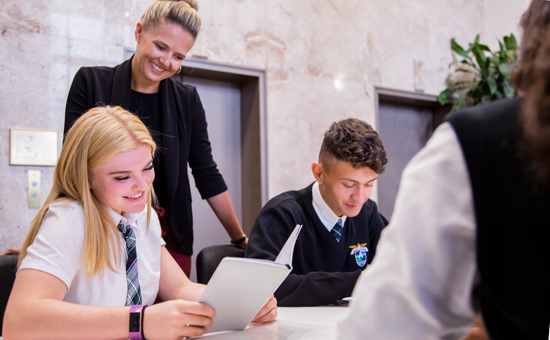 Alexander Academy teacher talking to student